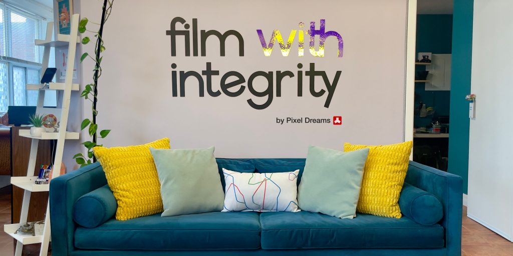 Pixel Dreams Film with Integrity logo wall